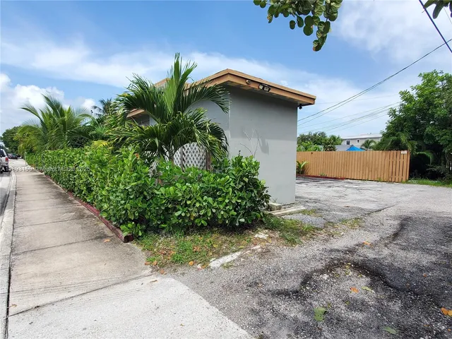 a potted plant sitting in front of a house