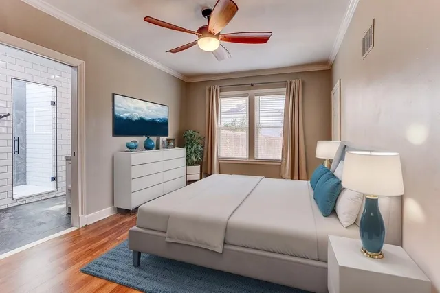 a view of room with window ceiling fan and wooden floor