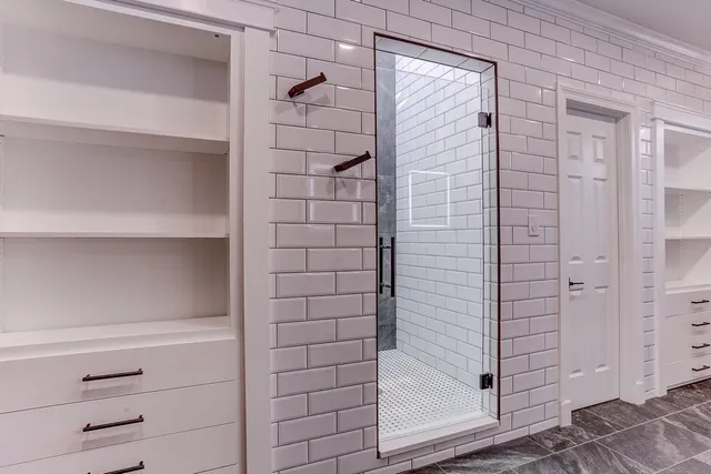 a living room with hard wood floors and a ceiling fan