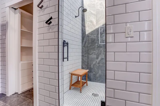 a view of a kitchen with a refrigerator and a window