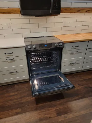 a view of a fence and trees