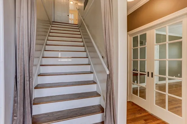 a view of staircase with white walls and windows