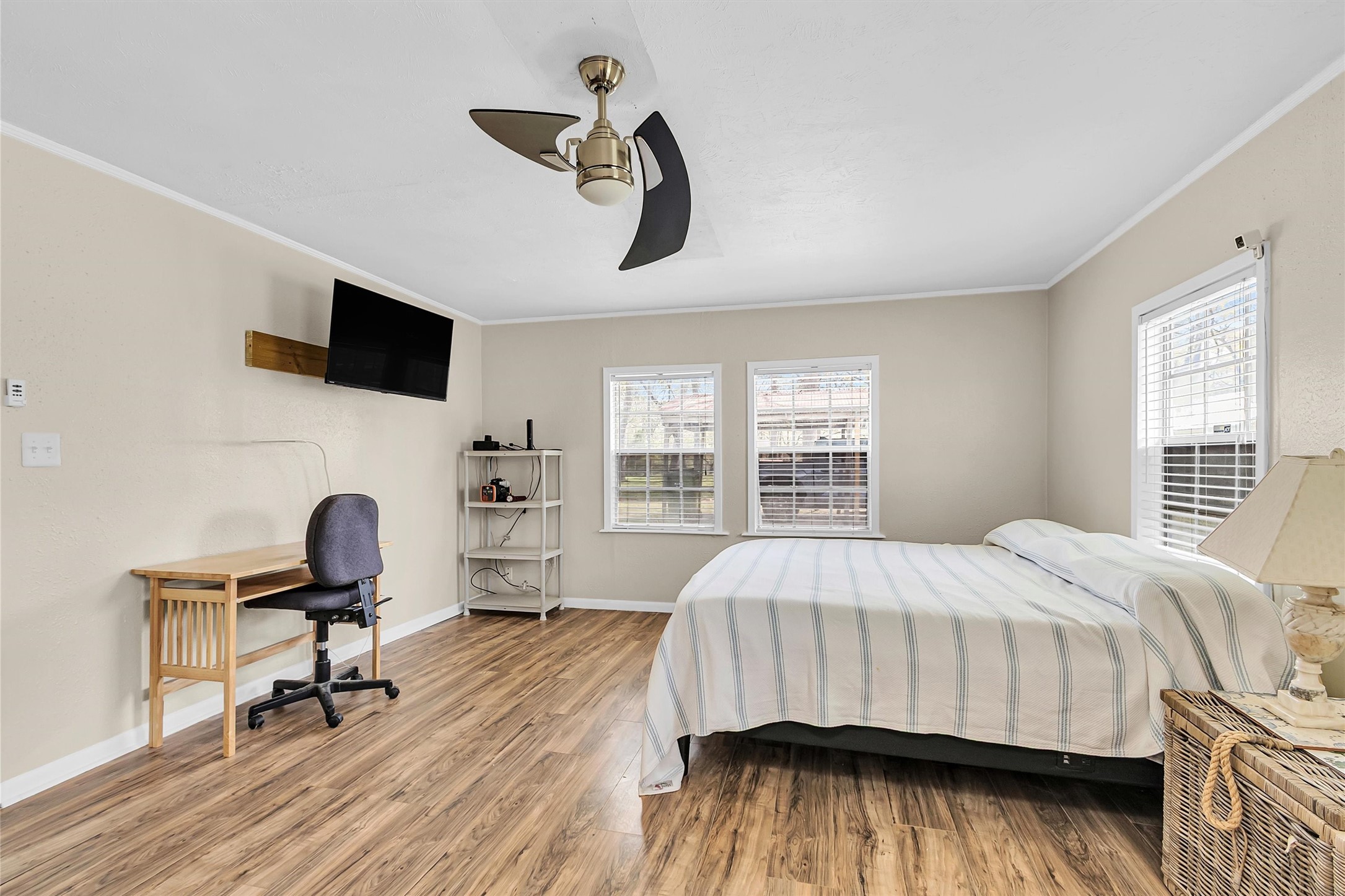 95 Main Street Huntsville, TX 77340 - Photo 13 of 30 a bedroom with a bed and a flat screen tv