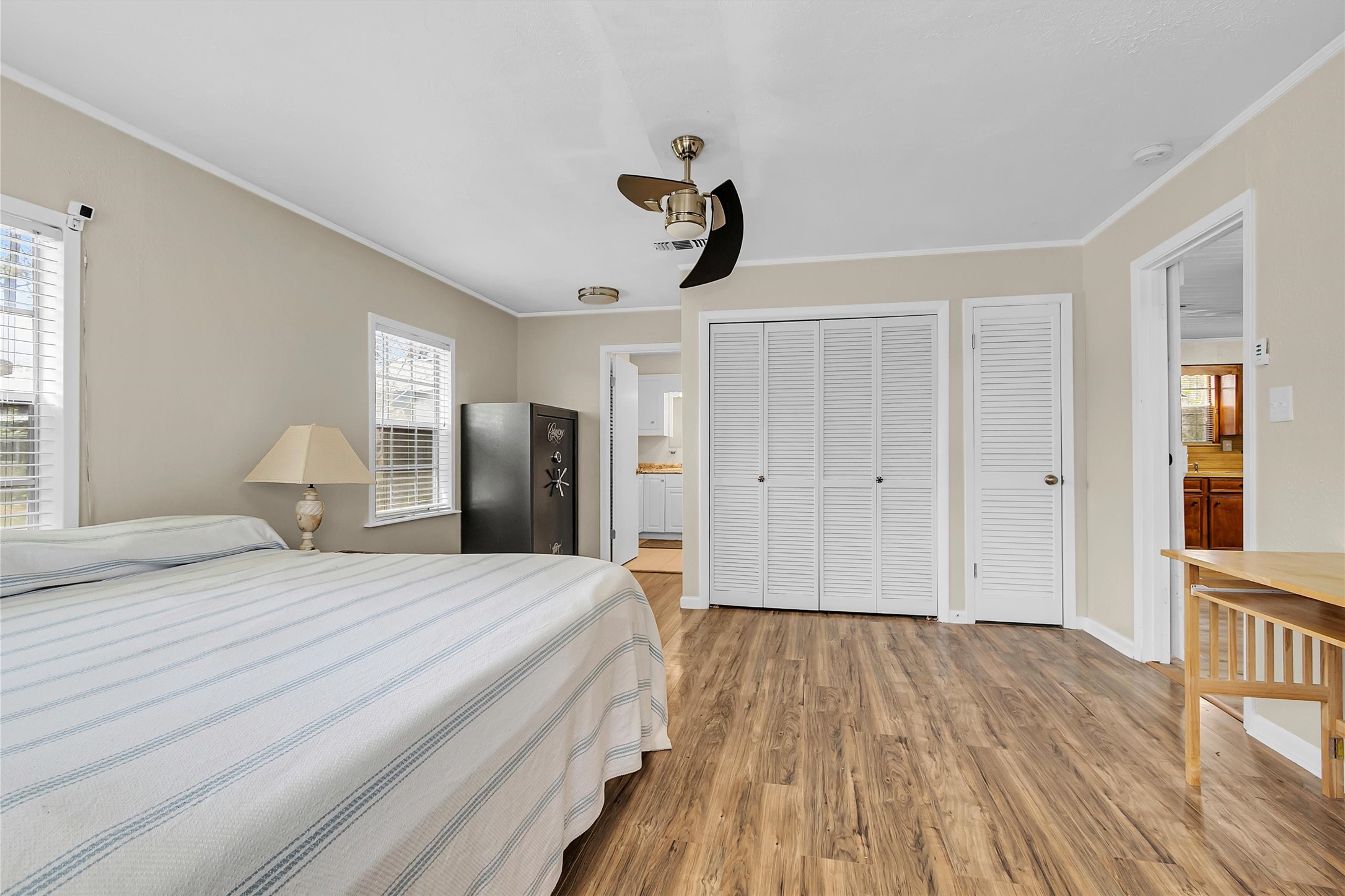 95 Main Street Huntsville, TX 77340 - Photo 14 of 30 a bedroom with a bed and wooden floor
