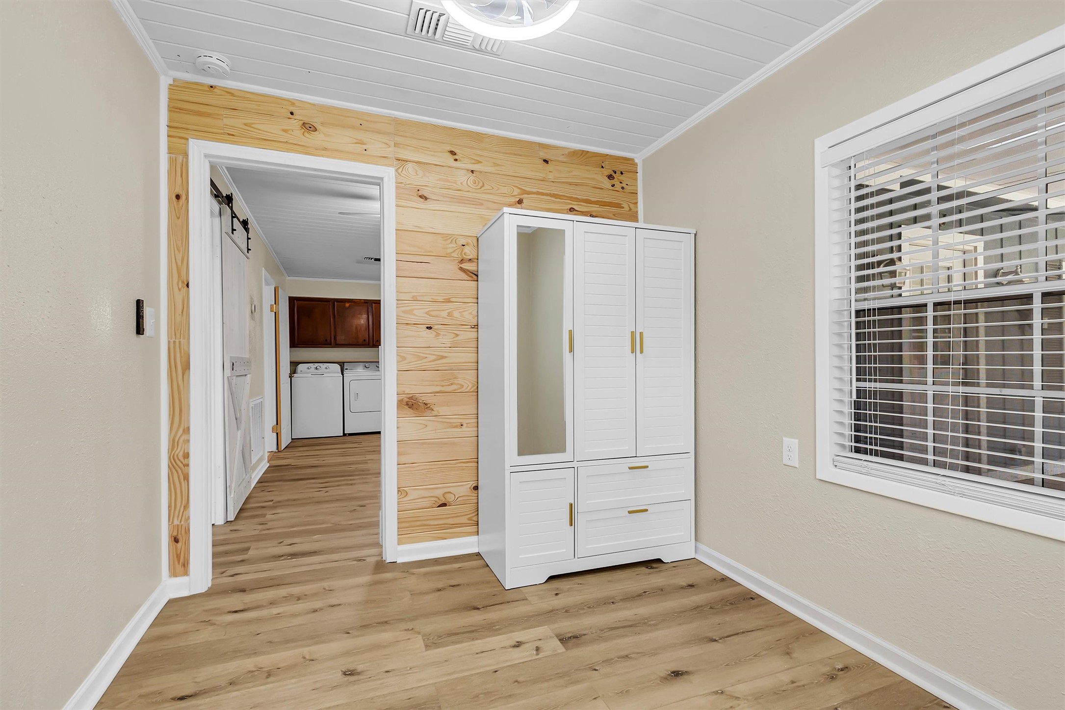 95 Main Street Huntsville, TX 77340 - Photo 16 of 30 a view of a hallway with wooden floor and entryway