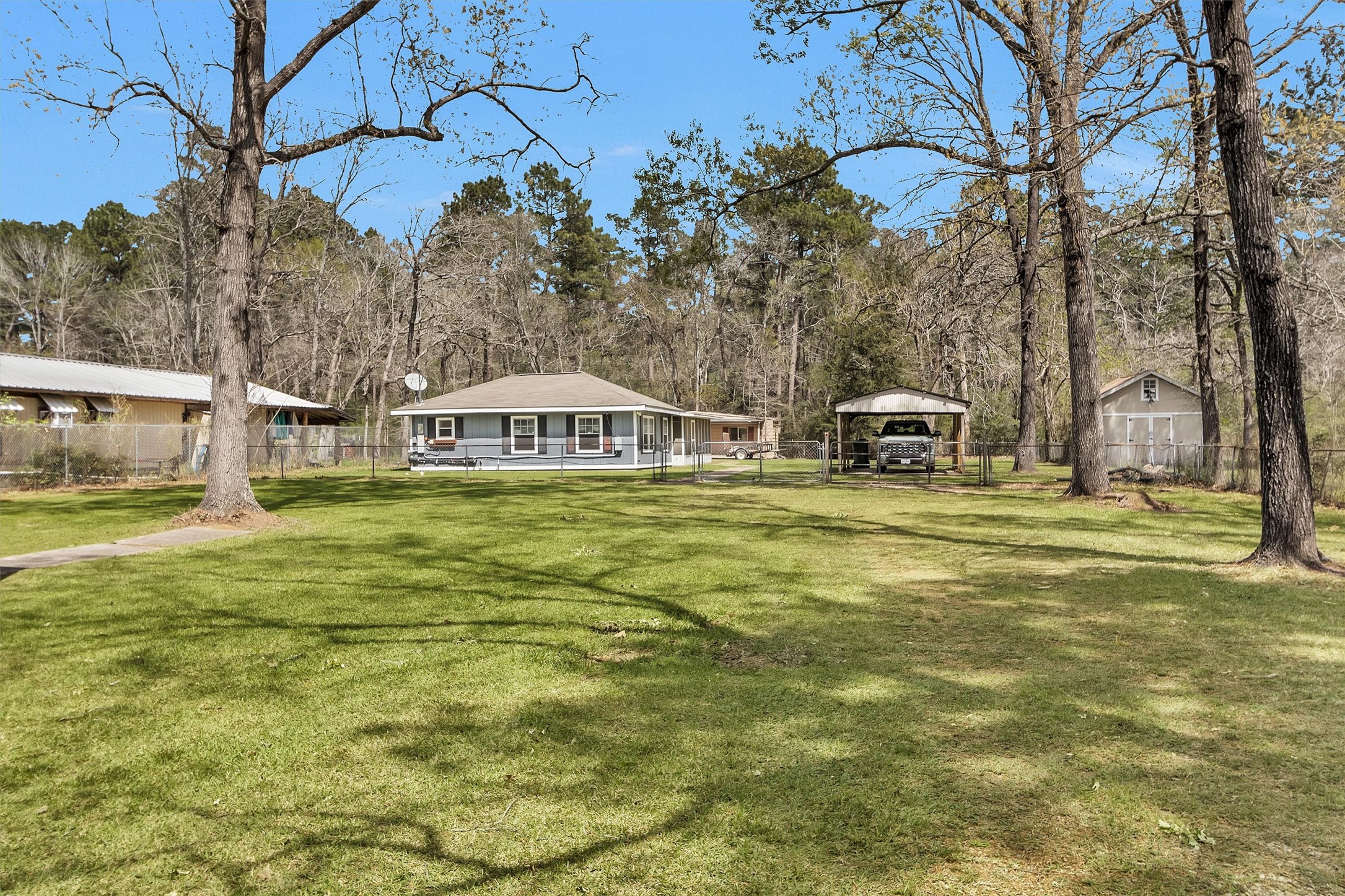 95 Main Street Huntsville, TX 77340 - Photo 2 of 30 a swimming pool with outdoor seating and yard