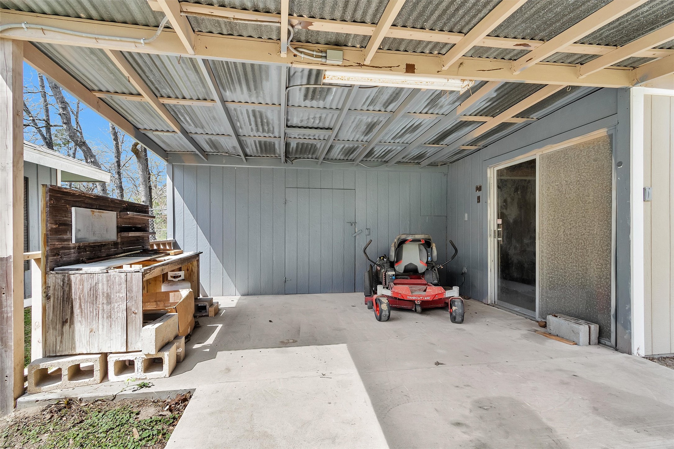 95 Main Street Huntsville, TX 77340 - Photo 21 of 30 a living room with furniture and a flat screen tv