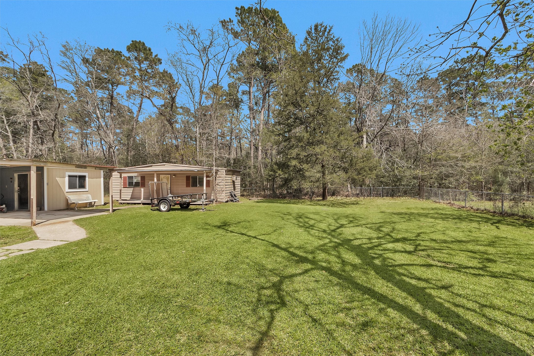 95 Main Street Huntsville, TX 77340 - Photo 23 of 30 a view of a house with a yard