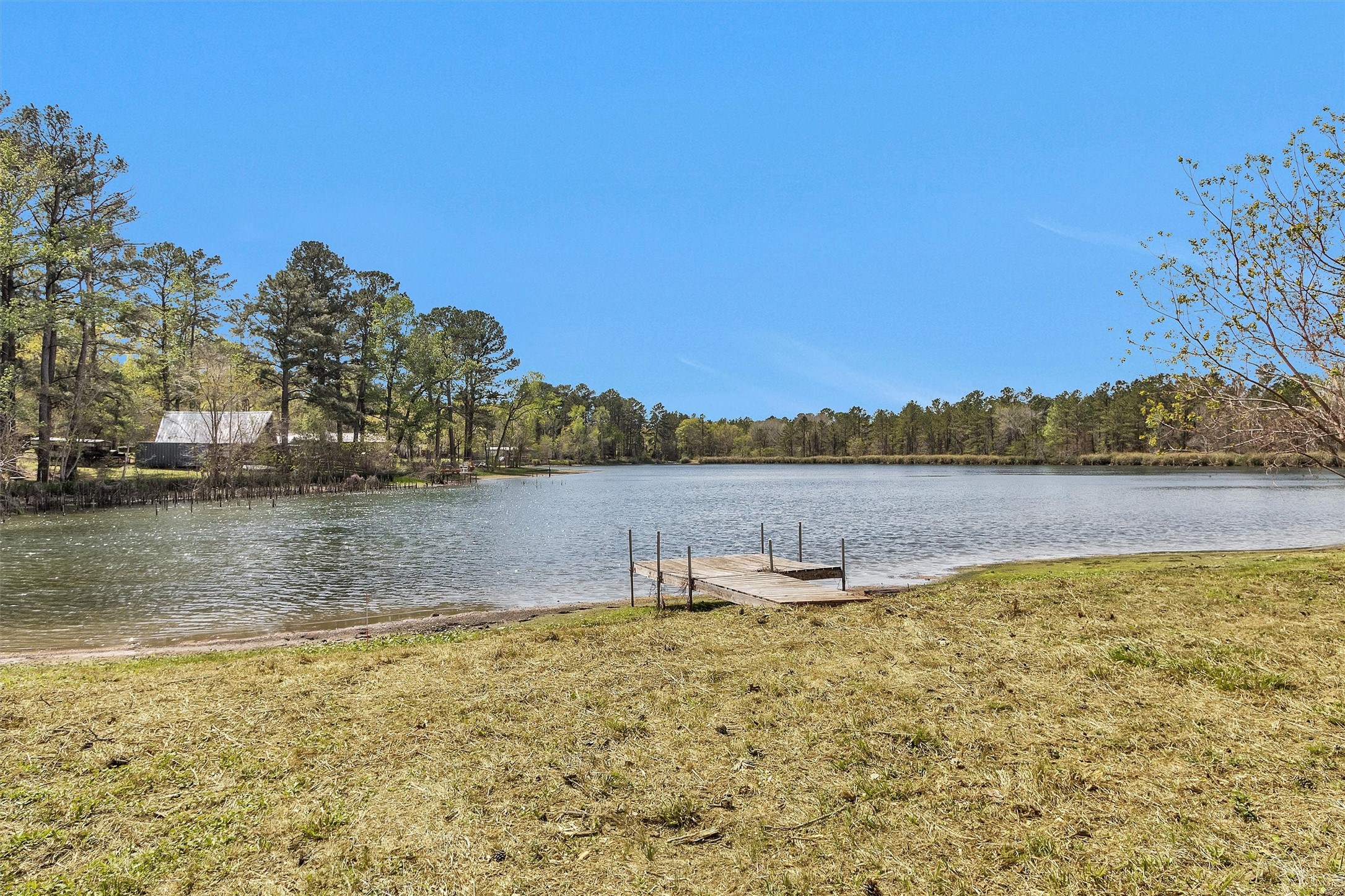 95 Main Street Huntsville, TX 77340 - Photo 27 of 30 a view of a lake with houses in the back