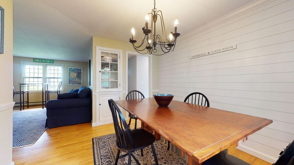 290 Riverview Lane Barnstable, MA 02632 - Photo 12 of 31 a view of a dining room with furniture wooden floor and chandelier