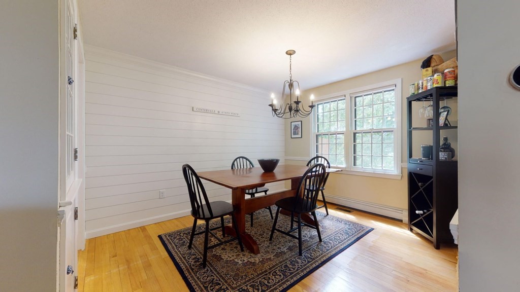 290 Riverview Lane Barnstable, MA 02632 - Photo 14 of 31 a view of a dining room with furniture window and wooden floor