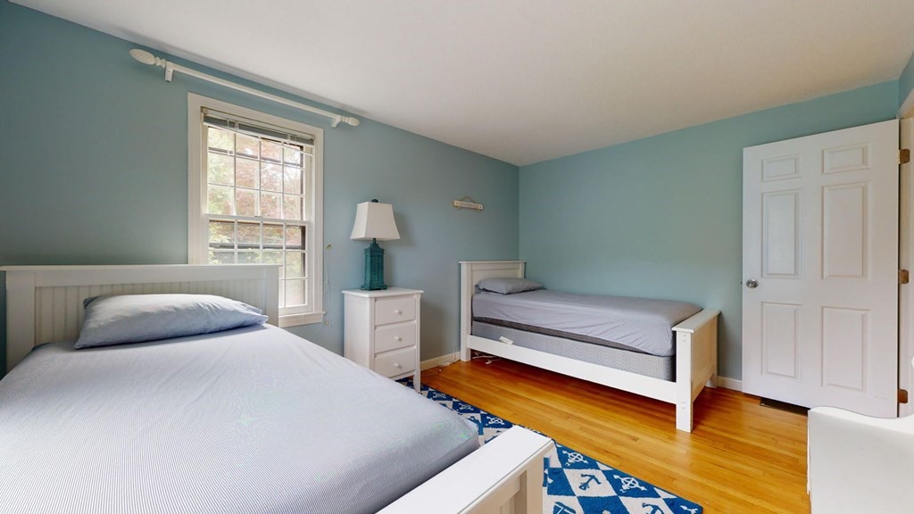 290 Riverview Lane Barnstable, MA 02632 - Photo 18 of 31 a bedroom with a bed and windows