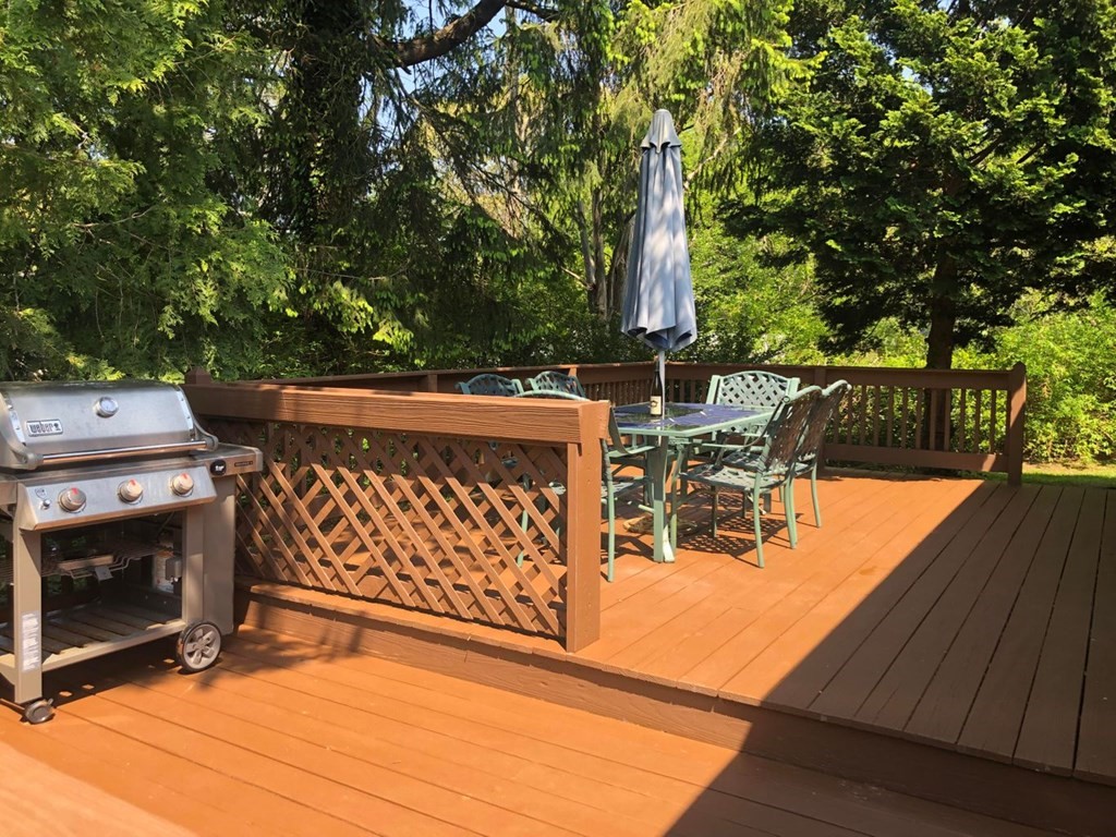 290 Riverview Lane Barnstable, MA 02632 - Photo 27 of 31 a view of a chairs and tables in the back yard of a house