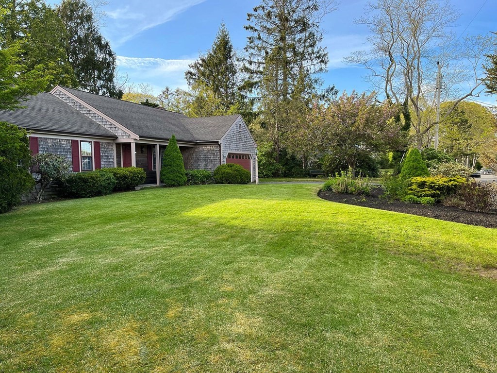 290 Riverview Lane Barnstable, MA 02632 - Photo 29 of 31 a front view of a house with yard and green space
