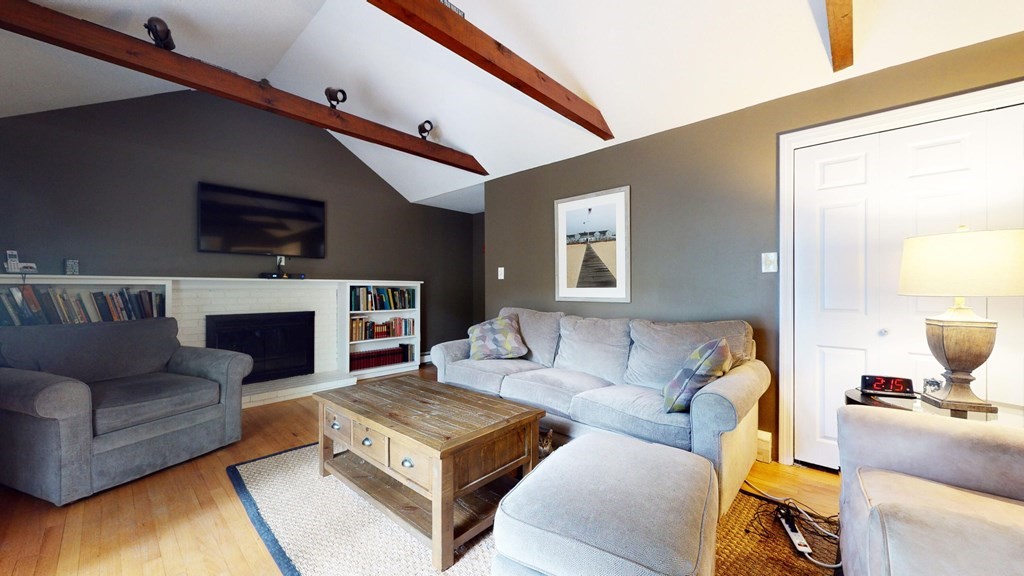 290 Riverview Lane Barnstable, MA 02632 - Photo 6 of 31 a living room with furniture and a fireplace