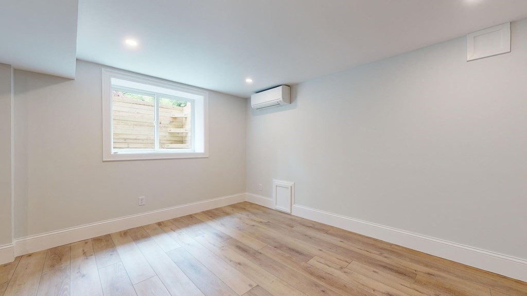 290 Riverview Lane Barnstable, MA 02632 - Photo 8 of 31 wooden floor in an empty room with a window