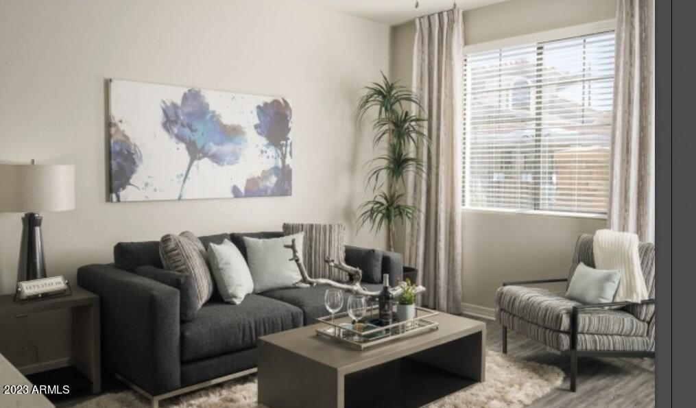 2910 South Greenfield Road, Unit B3B Gilbert, AZ 85295 - Photo 2 of 13 a living room with furniture and a large window