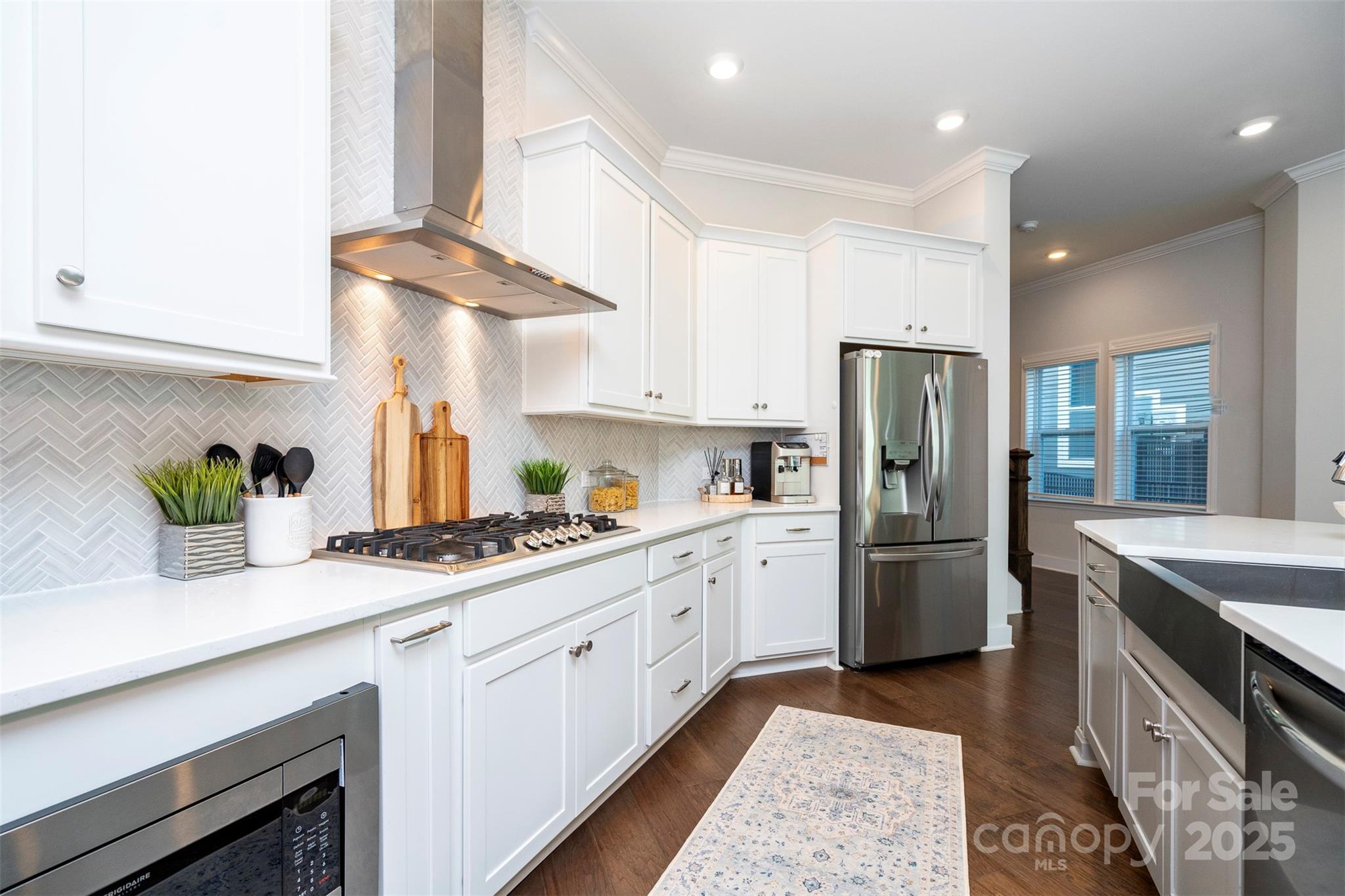 2523 Lola Avenue Charlotte, NC 28205 - Photo 15 of 40 a kitchen with stainless steel appliances granite countertop a sink a stove a refrigerator and cabinets