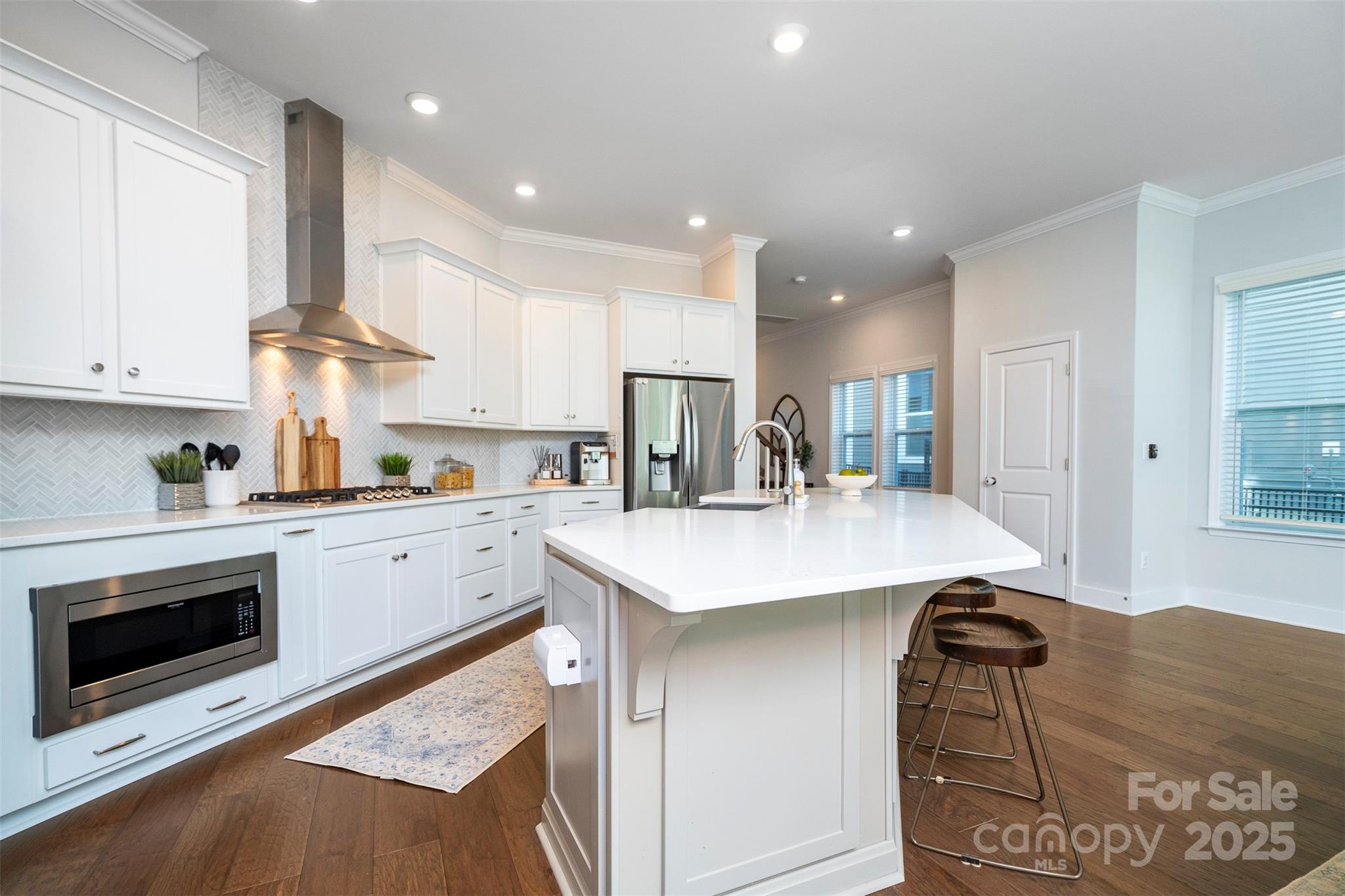 2523 Lola Avenue Charlotte, NC 28205 - Photo 18 of 40 a kitchen with a sink a stove and cabinets