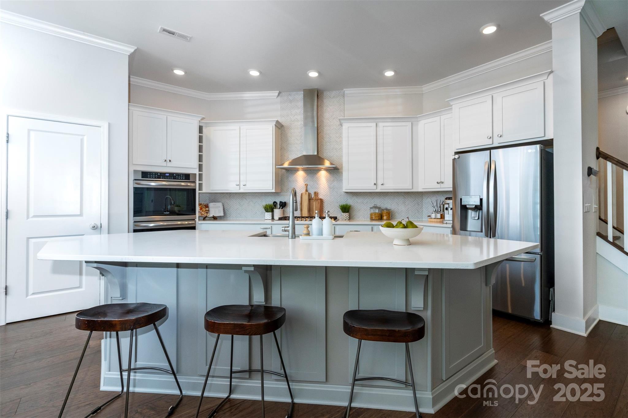 2523 Lola Avenue Charlotte, NC 28205 - Photo 19 of 40 a kitchen with stainless steel appliances granite countertop a sink and a refrigerator