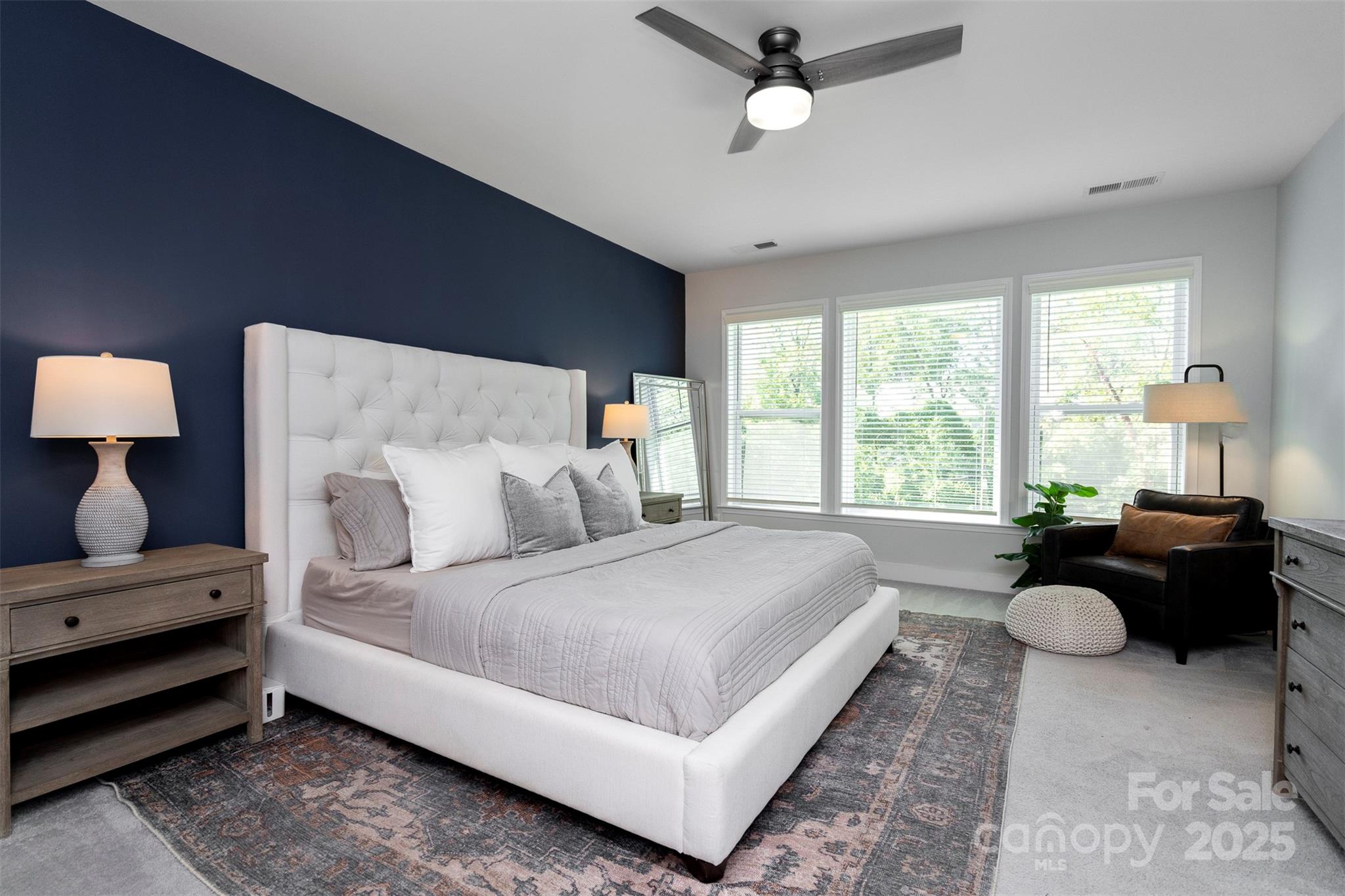 2523 Lola Avenue Charlotte, NC 28205 - Photo 20 of 40 a spacious bedroom with a bed and wooden floor