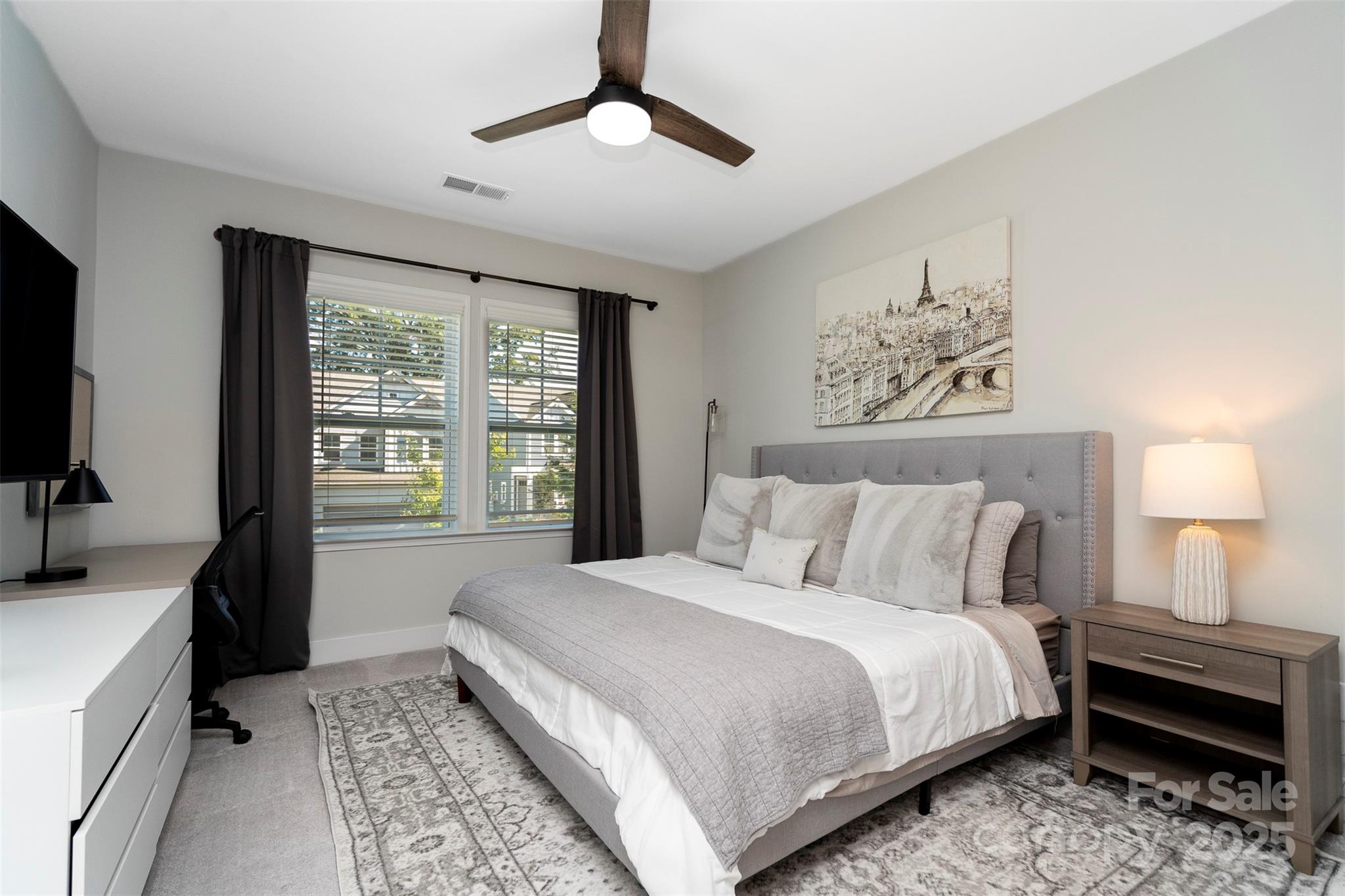 2523 Lola Avenue Charlotte, NC 28205 - Photo 26 of 40 a bedroom with a large bed and a window