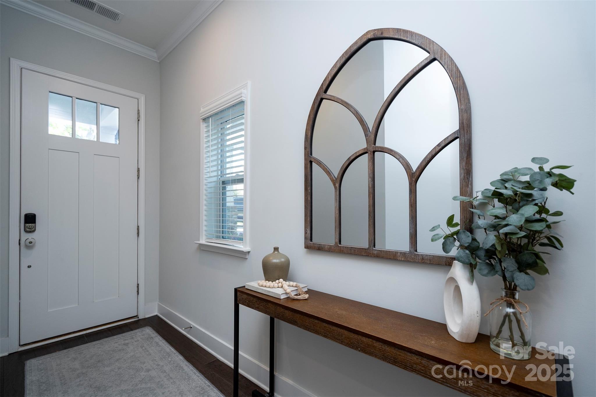 2523 Lola Avenue Charlotte, NC 28205 - Photo 3 of 40 a room with a table and a potted plant