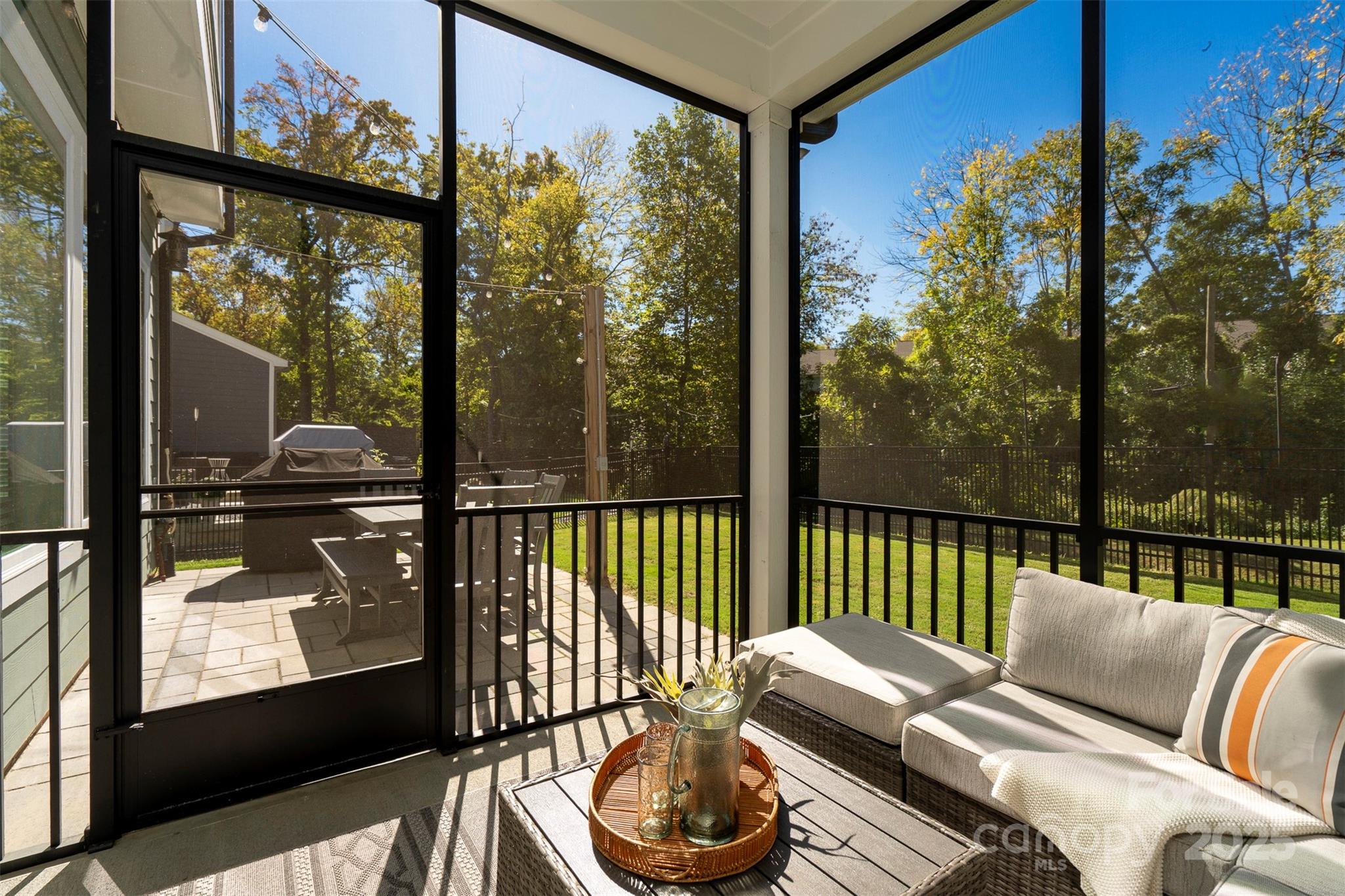 2523 Lola Avenue Charlotte, NC 28205 - Photo 31 of 40 a balcony with furniture and a floor to ceiling window