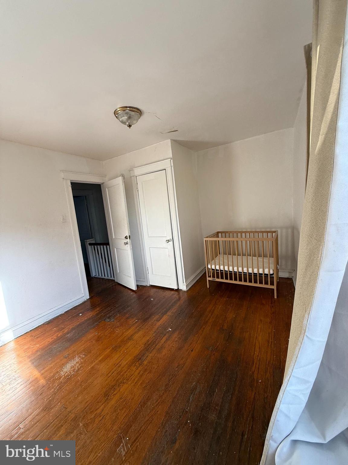 411 Timberlake Road Upper Darby, PA 19082 - Photo 11 of 15 a view of a room with wooden floor and a window