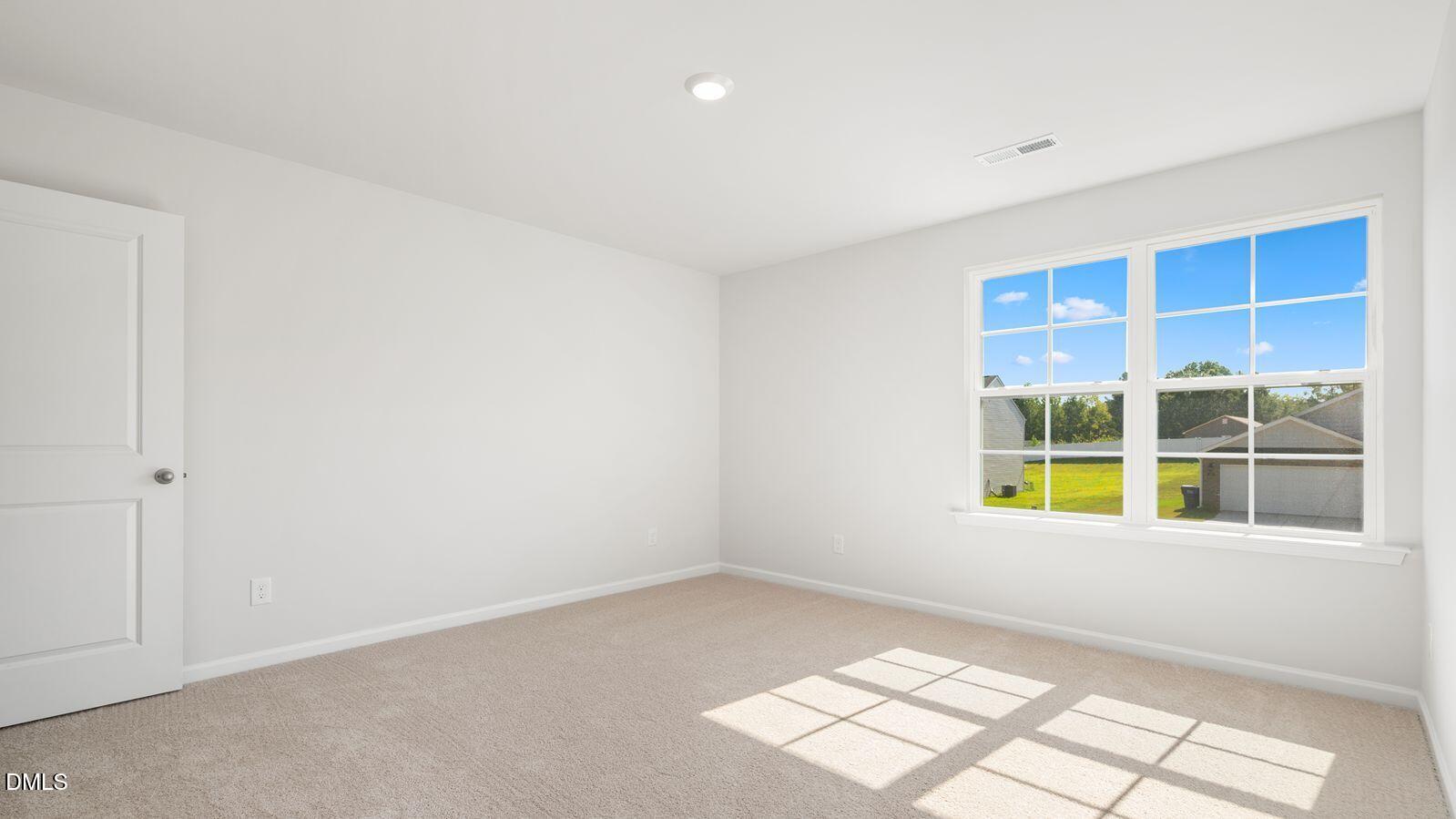 122 Daniel Road Smithfield, NC 27577 - Photo 11 of 22 a view of an empty room with a window