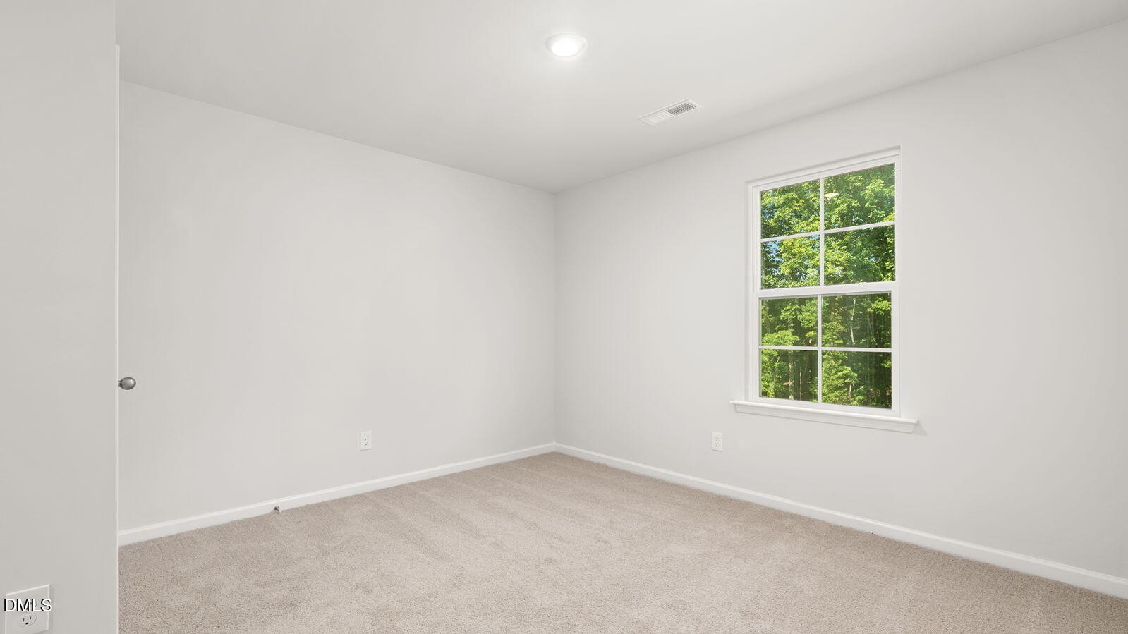 122 Daniel Road Smithfield, NC 27577 - Photo 18 of 22 an empty room with a window