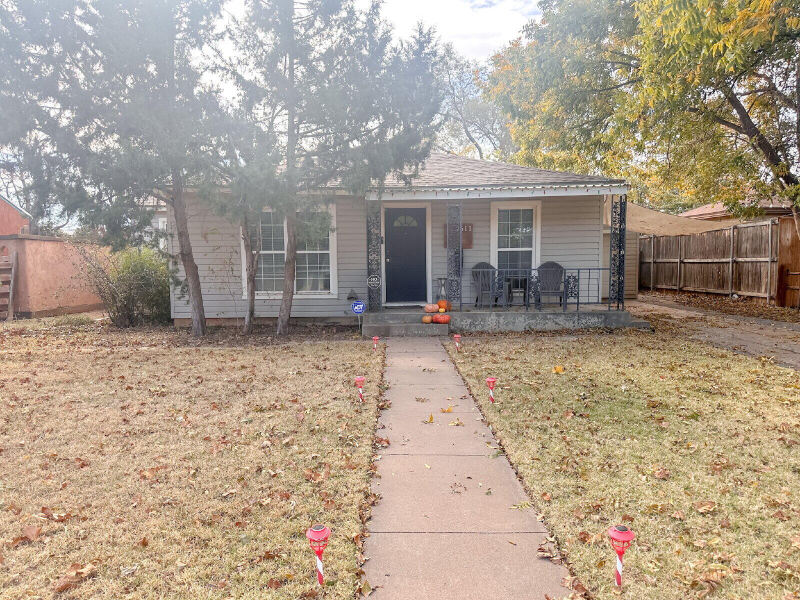 2611 29th Street Lubbock, TX 79410 - Photo 9 of 9 a front view of house with yard outdoor seating and barbeque oven
