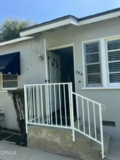 a view of a house with a small yard