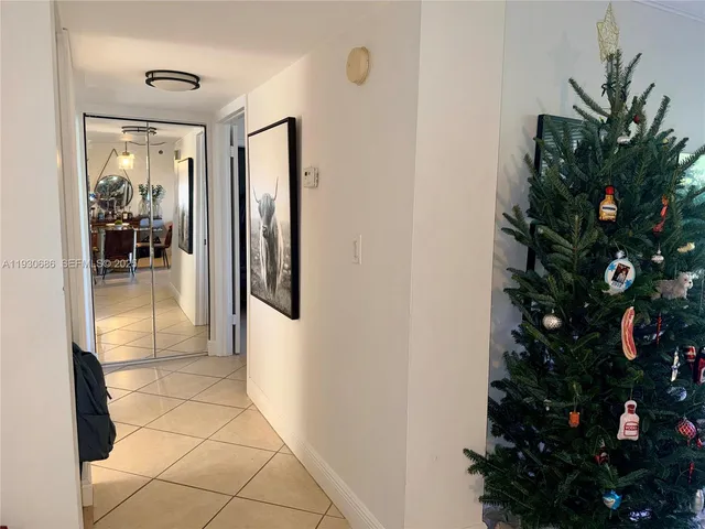 a bathroom with a sink a toilet a mirror and shower curtain