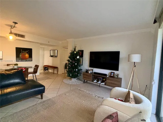 a kitchen with stainless steel appliances granite countertop a refrigerator a stove and a sink with cabinets