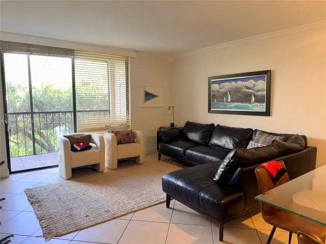 a kitchen with granite countertop a sink and cabinets