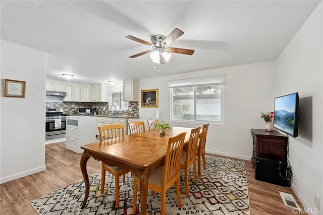 a dining room with furniture and window