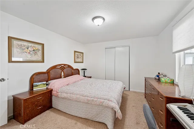 a bed room with a bed and a couch