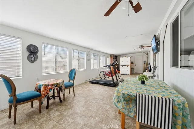 a view of a livingroom with furniture and a window