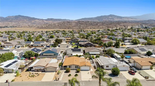 an aerial view of multiple houses with outdoor space