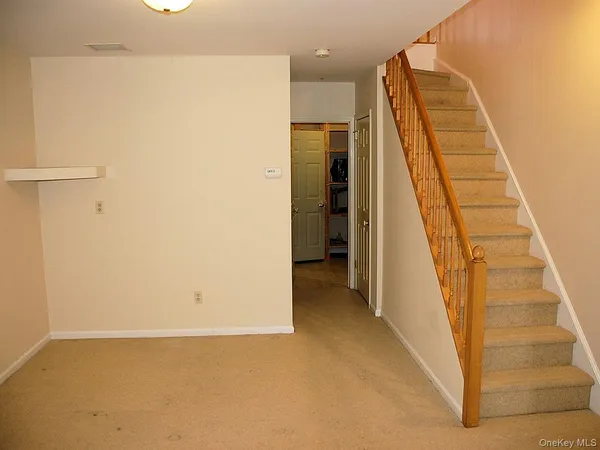 a view of a hallway with staircase