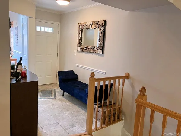 a view of a hallway with paintings on the wall