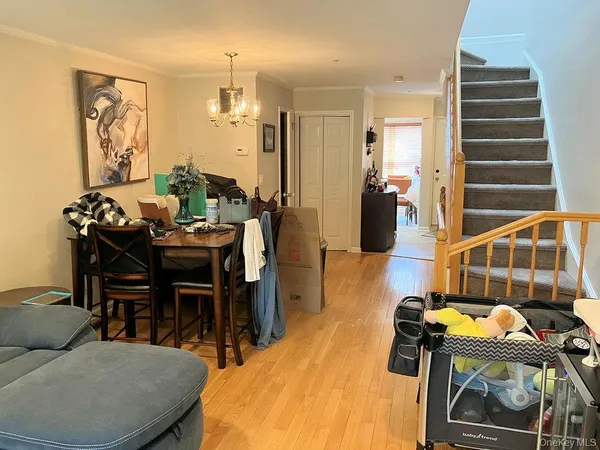 a dining room with furniture and wooden floor