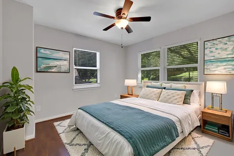 a bedroom with a large bed and a window