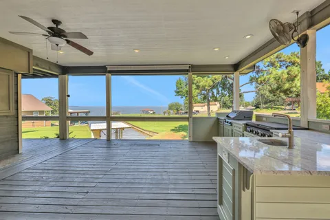 a view of a kitchen with a sink and cabinets