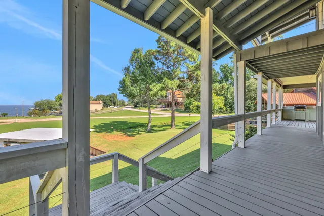a view of a porch with wooden floor