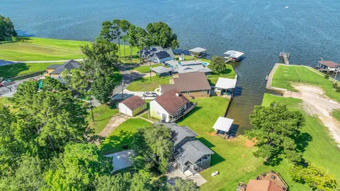 a view of a swimming pool with a yard