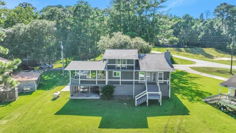 an aerial view of a house with a big yard