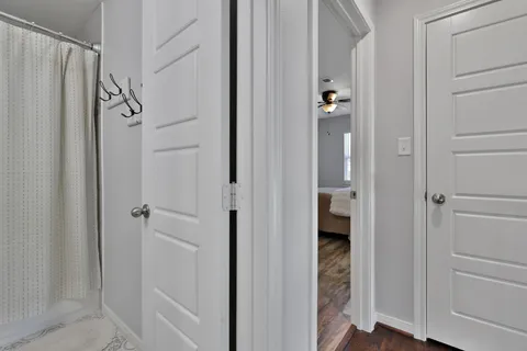 a bathroom with a shower and a glass door