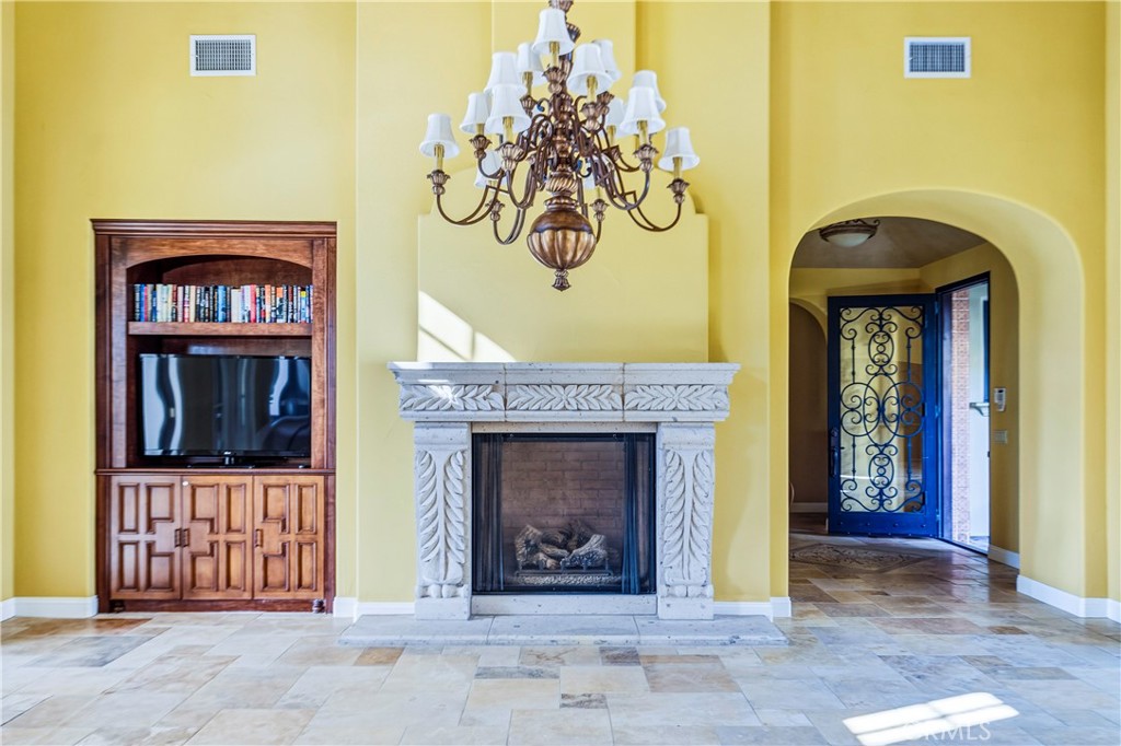 13 Cassis Circle Rancho Mirage, CA 92270 - Photo 11 of 51 a view of a entryway with a fireplace
